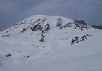 Mount Rainier from the south: the rock &#34;band&#34; in the center is the Wilson Headwall, with the Nisqually Icefall to the right of it. The prominent rock formation on the right is Gibraltar Rock.