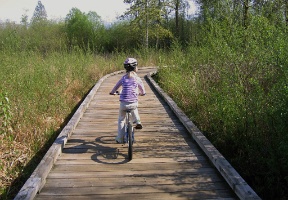 Johanna biking around Larsen Lake
