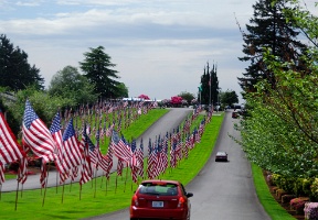 Flags at the entrance to the cemetery where grandpa Lenox and aunt Maggie are buried