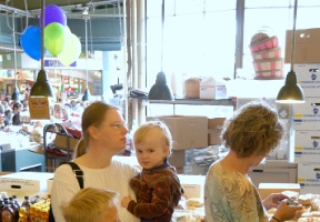 Amy, Elsa, Tuomas and Antti waiting in line for donuts