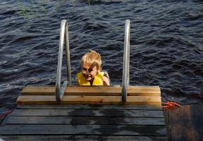 Tuomas testing his life vest in the lake