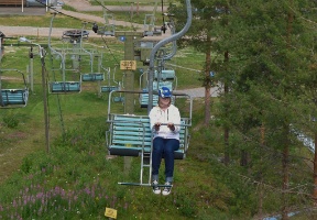 Johanna sitting in the ski lift at Ounasvaara
