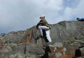 The boys playing on the rocks and small cliffs in Kaivopuisto