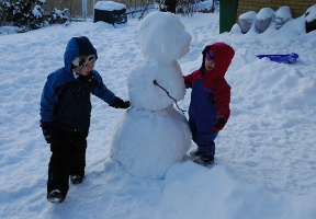 Antti and Elsa inspecting the old snow man, which has turned into solid ice