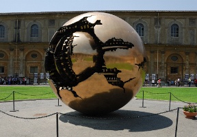 Sfera Con Sfera - Sphere Within Sphere - a bronze sculpture by Italian sculptor Arnaldo Pomodoro. The inner ball represents the Earth and outer ball represents Christianity. There are several versions of this sculpture around the world.