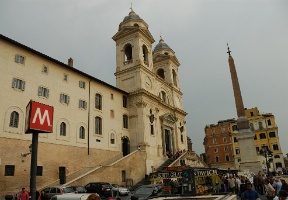 On our way back to our apartment. The big red M sign is for the Metro station at the Spanish Steps.