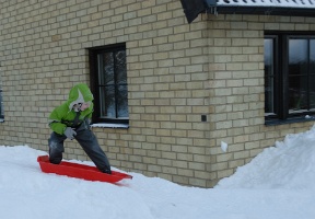 Antti sliding down a hill he and Tuomas made