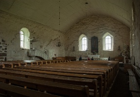 Inside the church looking towards the altar. The church has no floor and is simply exposed soil. This has interesting implications for acoustics.