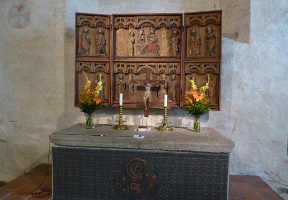 The altar artwork is from the 15th century.