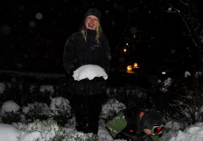 Johanna holding a snow "cap" that had covered a plant.