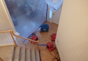 Drying the floors and walls after a broken water heater leaked water into the house while we were on vacation