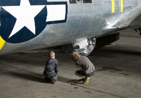 Antti and Tuomas inspecting a gun turret on the B-17